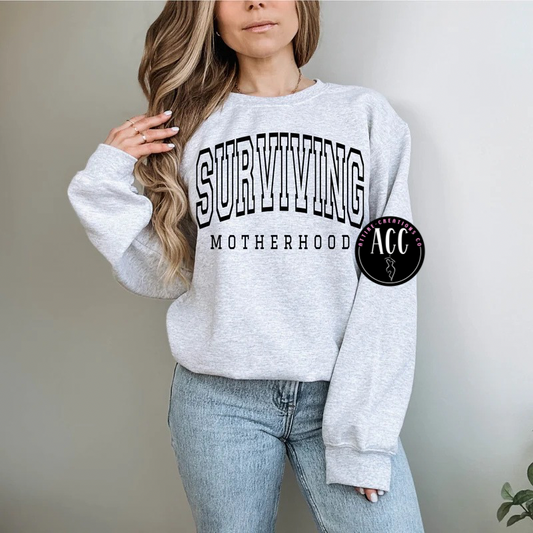 Surviving Motherhood- Funny Mom Life Tee